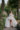 Bride walking in villa cipressi botanical garden
